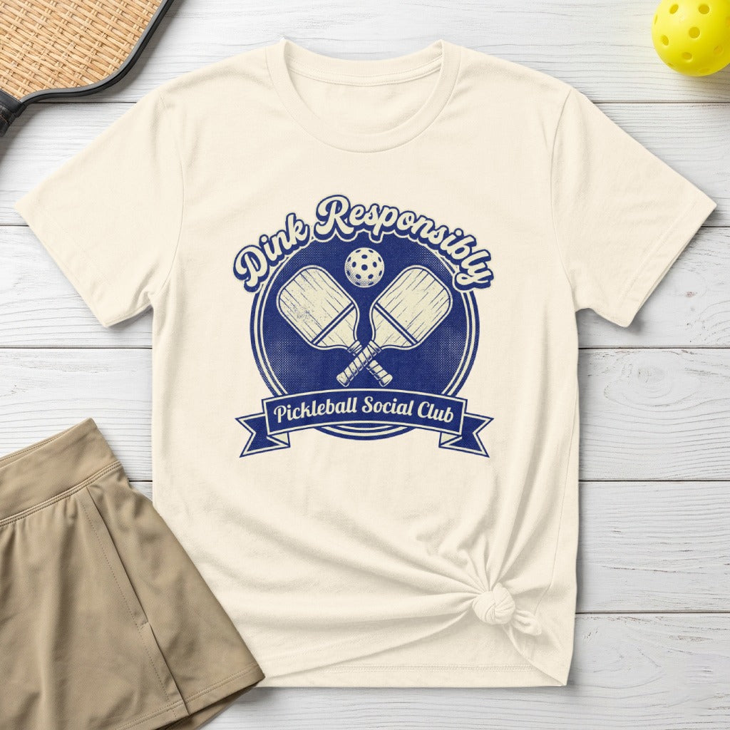 Dink Responsibly Pickleball Social Club t-shirt with crossed paddles design.