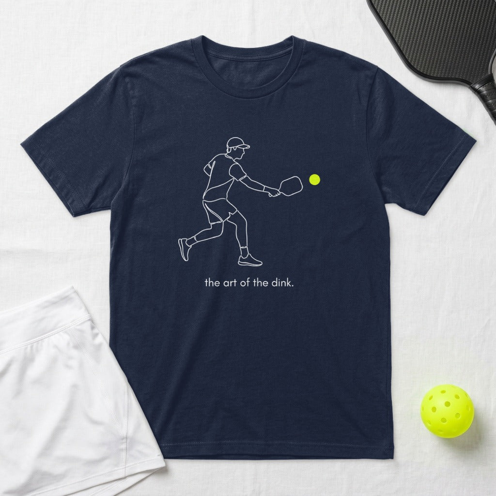 Navy t-shirt with pickleball player illustration and "the art of the dink." text.