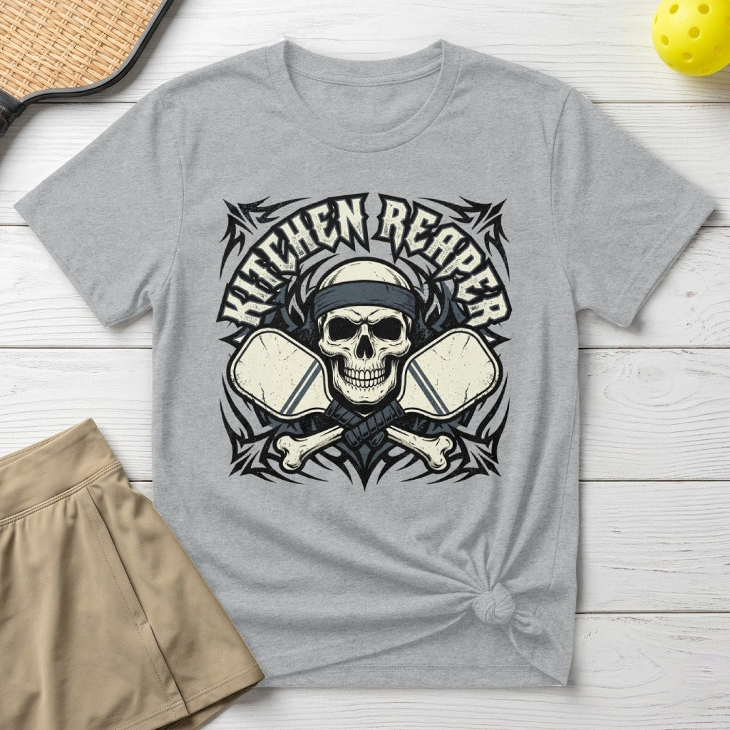 Grey t-shirt with skull, crossed pickleball paddles, and "Kitchen Reaper" text.