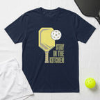 Navy t-shirt with yellow pickleball paddle and ball, "Stay in the Kitchen" text.