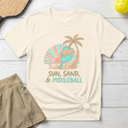 T-shirt with "Sun, Sand, & Pickleball" text and beach graphics.