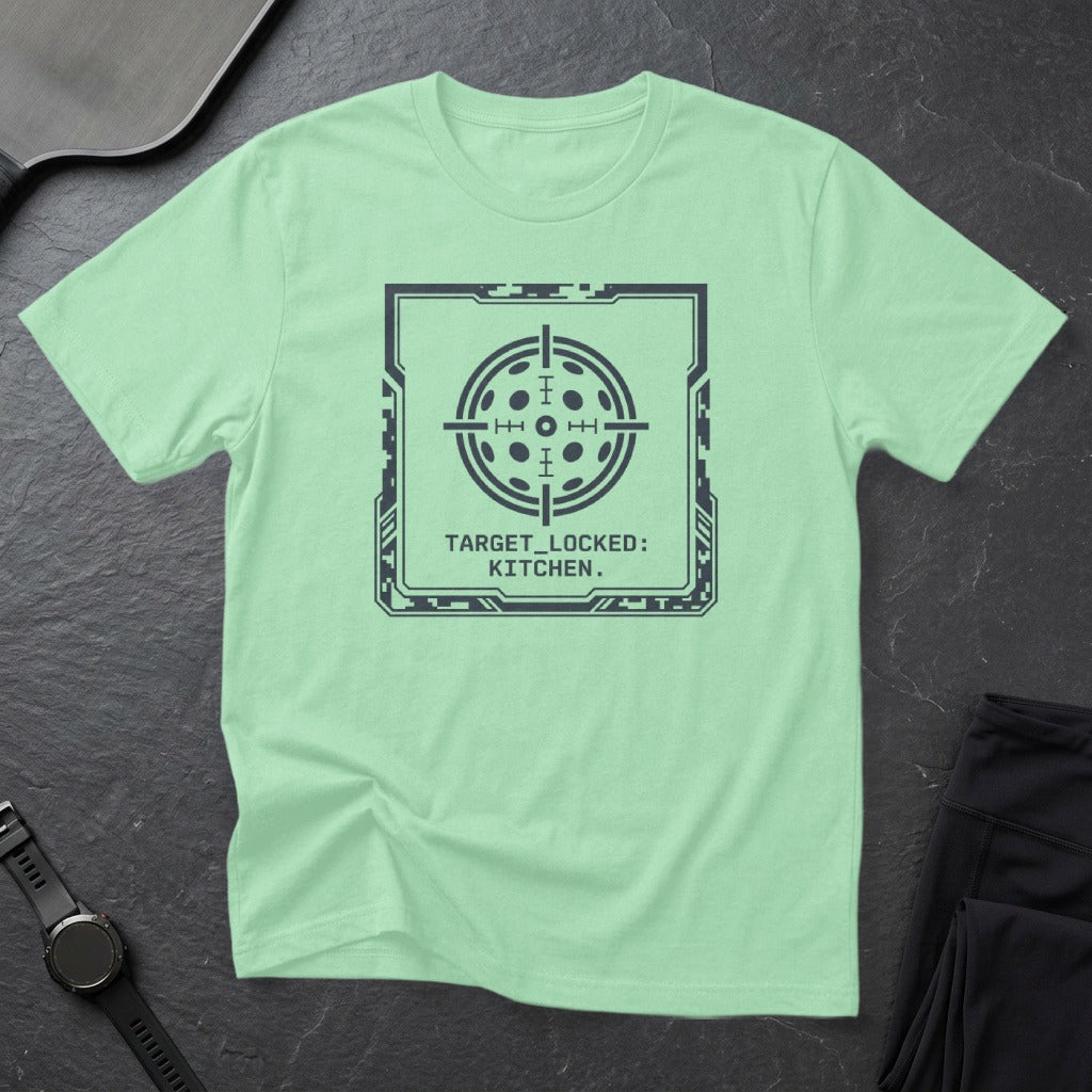 Mint t-shirt with a dark gray target reticle graphic and "TARGET_LOCKED: KITCHEN." text.