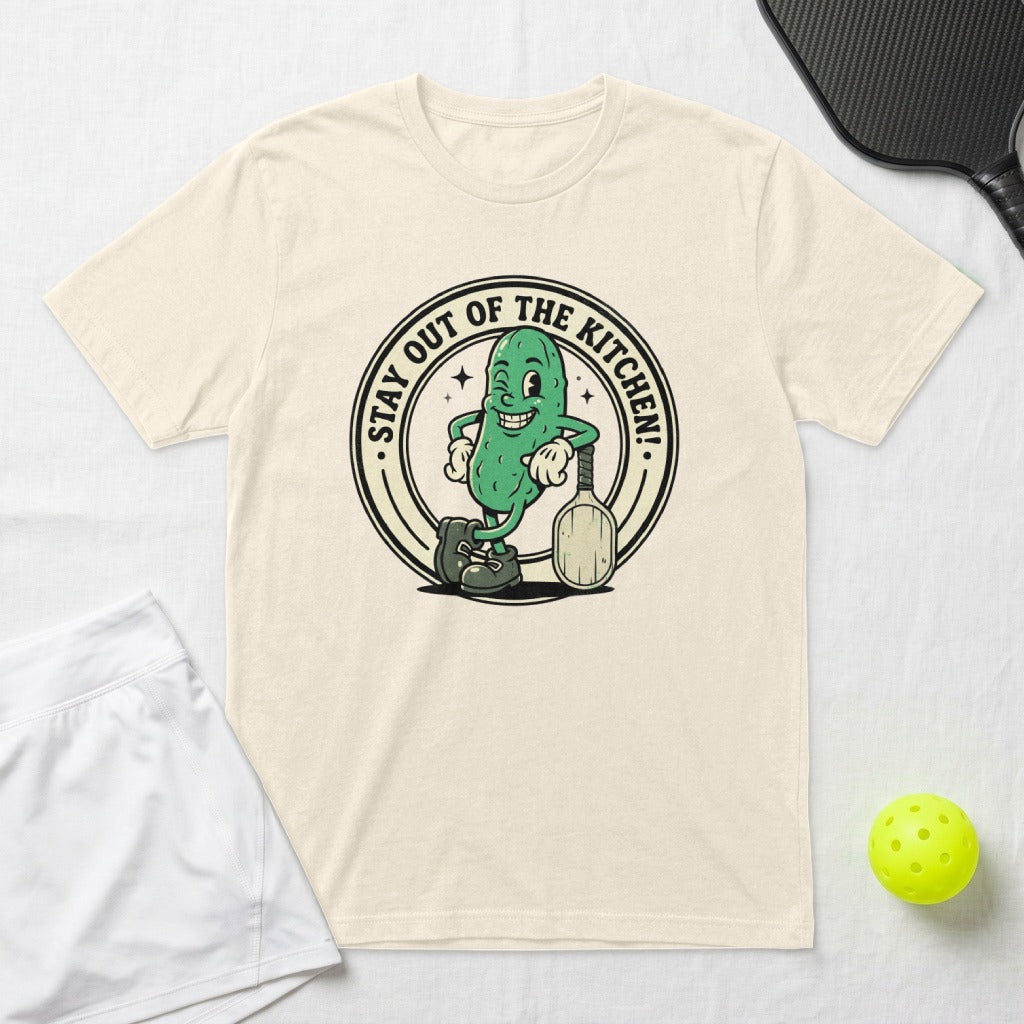 Cartoon pickle character with pickleball paddle and text "Stay Out of the Kitchen!"