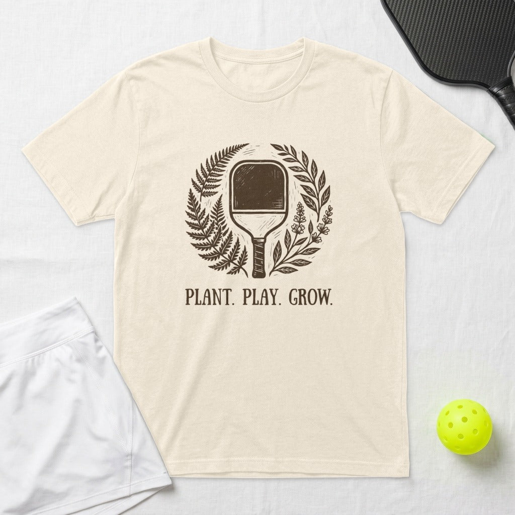 T-shirt with pickleball paddle design and "PLANT. PLAY. GROW." text.