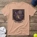 Peach t-shirt with a celestial-themed pickleball paddle graphic and text "The Paddle."