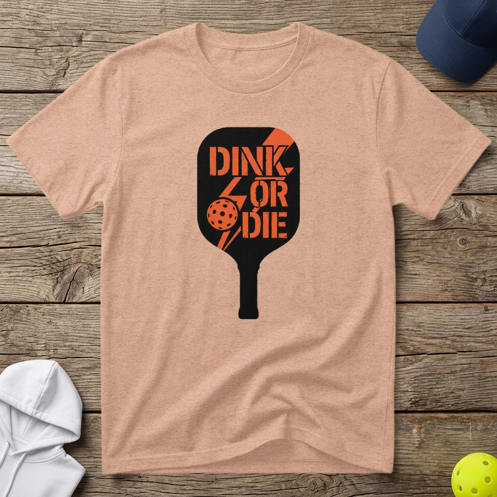 Peach t-shirt with black pickleball paddle graphic and "DINK OR DIE" text.