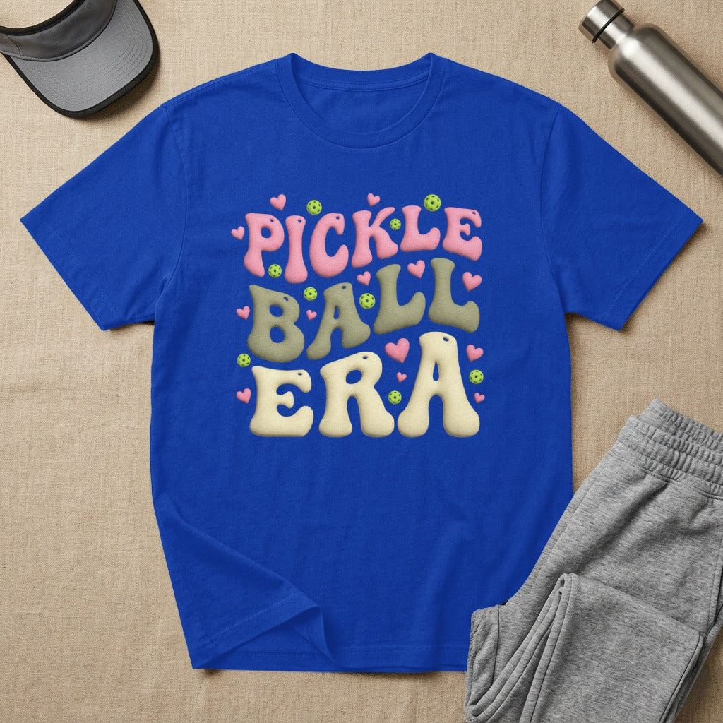 Blue t-shirt with "PICKLE BALL ERA" in colorful, retro bubble letters.