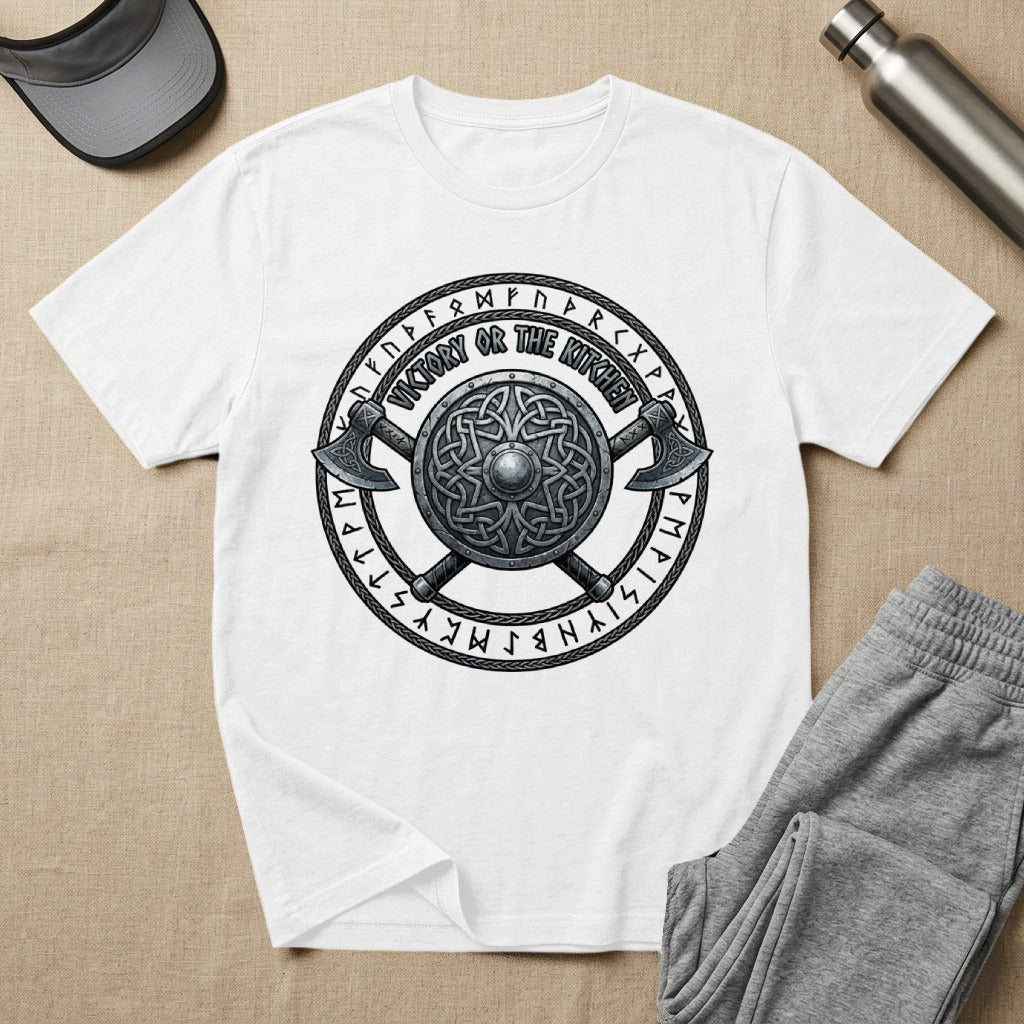 White t-shirt featuring a Viking shield, axes, and text "Victory or the Kitchen".