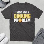 Dithering t-shirt with "I might have a dinking problem" and pickleball graphic.