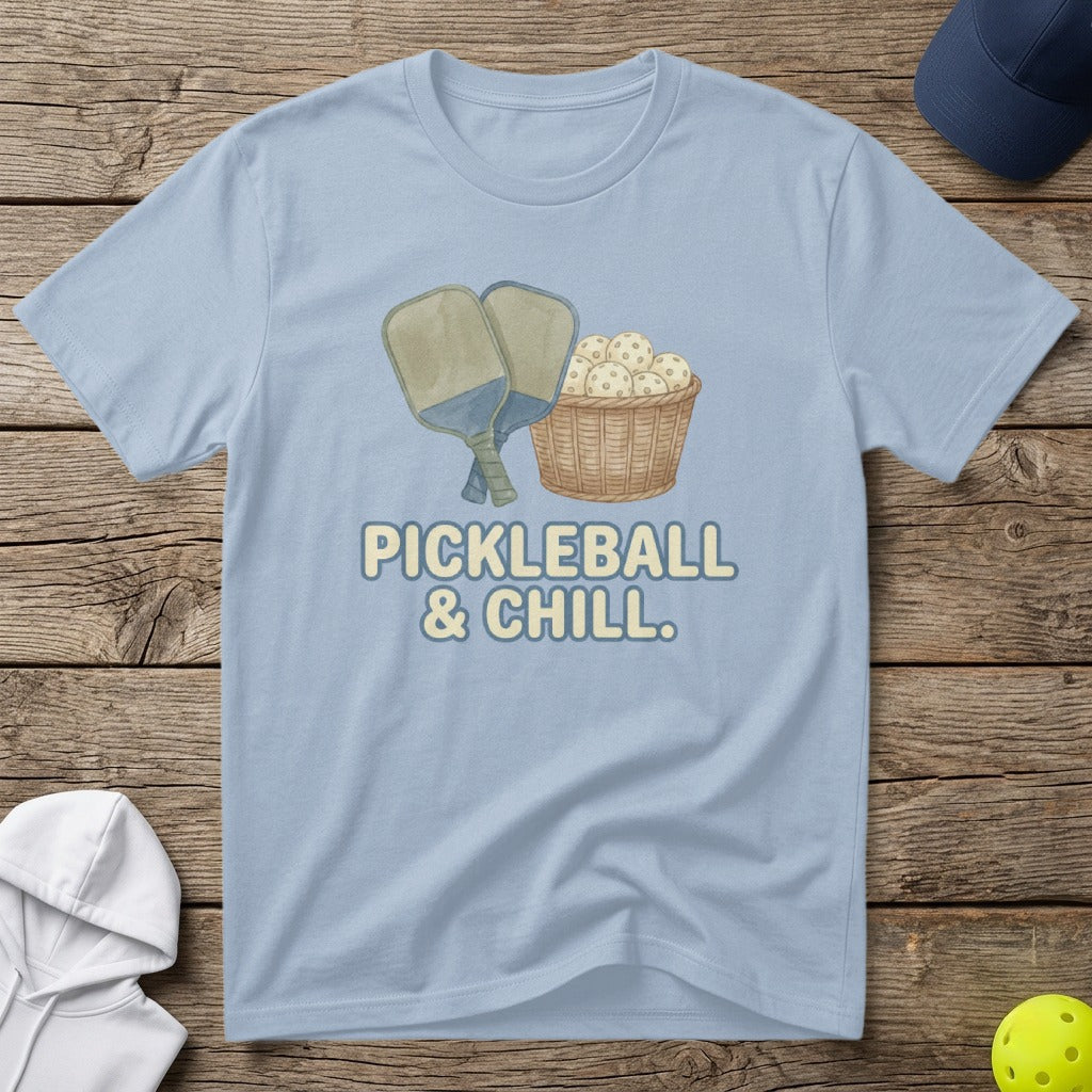 Light blue t-shirt with "PICKLEBALL & CHILL" text and pickleballs in a basket.