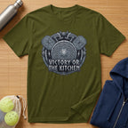 Green t-shirt with "Victory or the Kitchen" Viking-themed graphic.