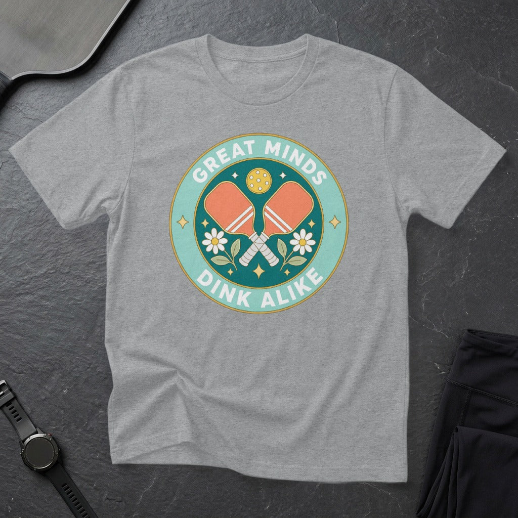 T-shirt with "Great Minds Dink Alike" and pickleball paddles and flowers graphic.