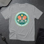 T-shirt with "Great Minds Dink Alike" and pickleball paddles and flowers graphic.