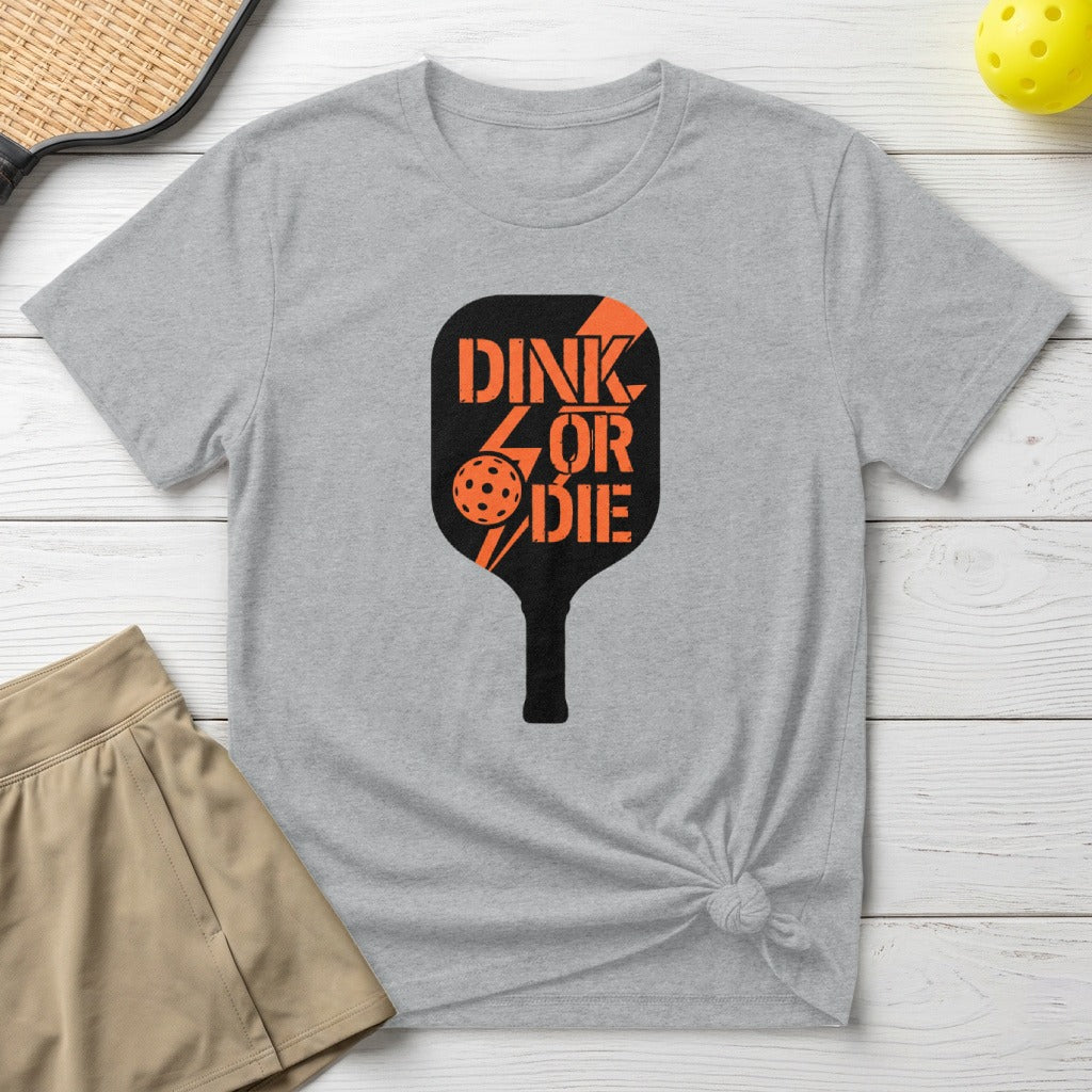 Gray t-shirt with orange "Dink or Die" pickleball paddle graphic.