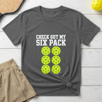 Gray t-shirt with "CHECK OUT MY SIX PACK" and six pickleballs graphic.