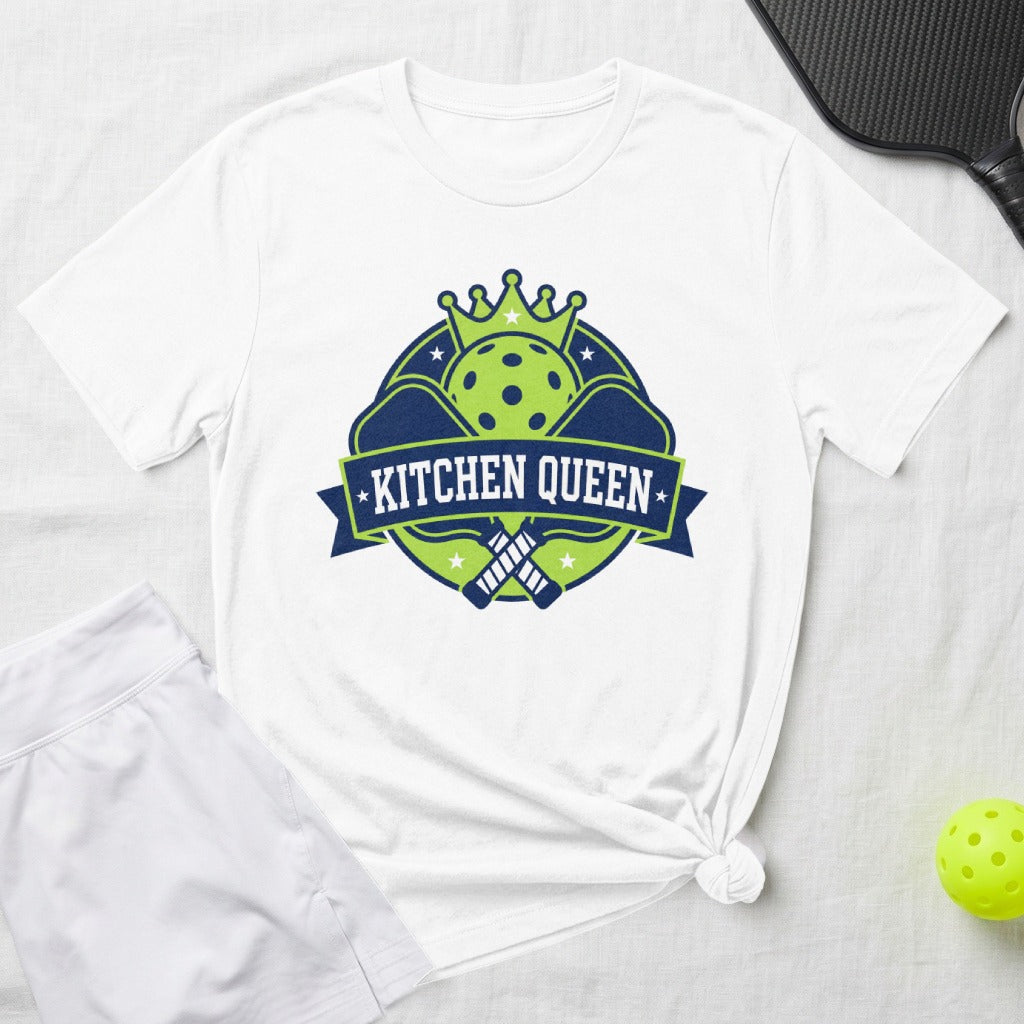 White t-shirt with "Kitchen Queen" emblem, pickleball paddles, and crown.