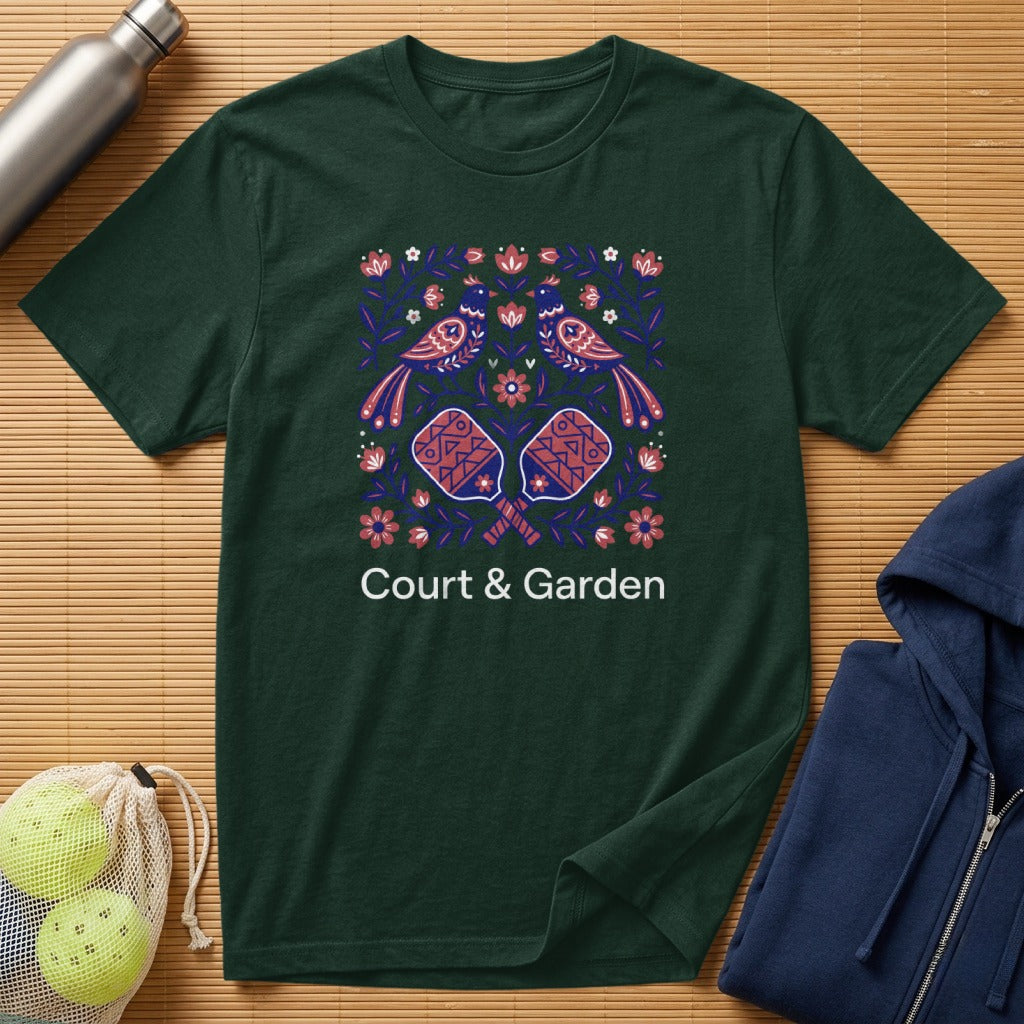 Dark green t-shirt with "Court & Garden" text and decorative paddles and birds.