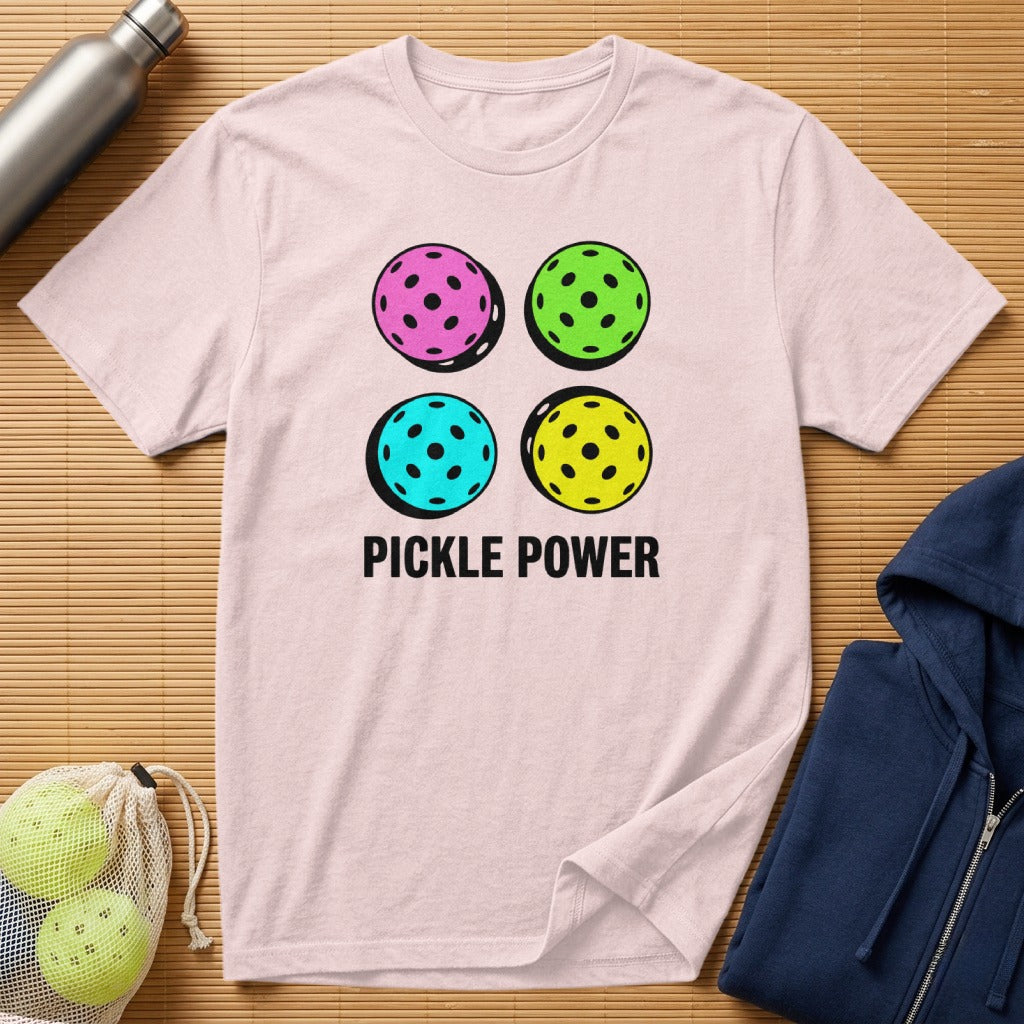 Pink t-shirt with four colorful pickleballs and "PICKLE POWER" text.