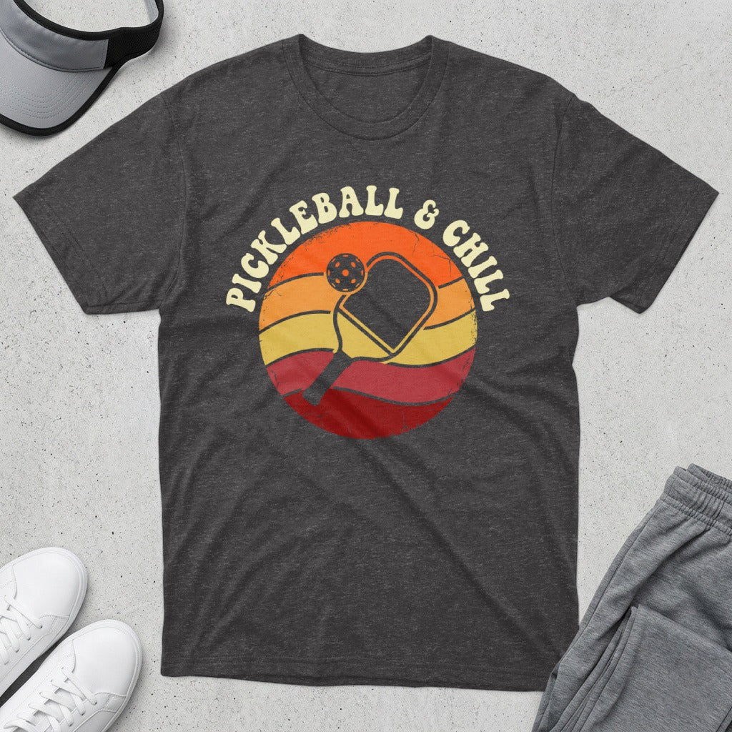 Dark t-shirt with "Pickleball & Chill" text and a retro sunset graphic.