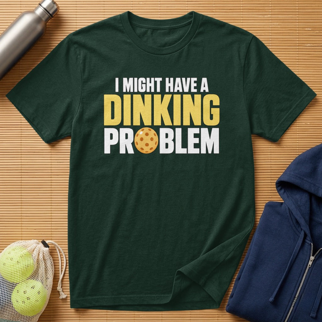 Dark green t-shirt with "I Might Have a Dinking Problem" and pickleball graphic.