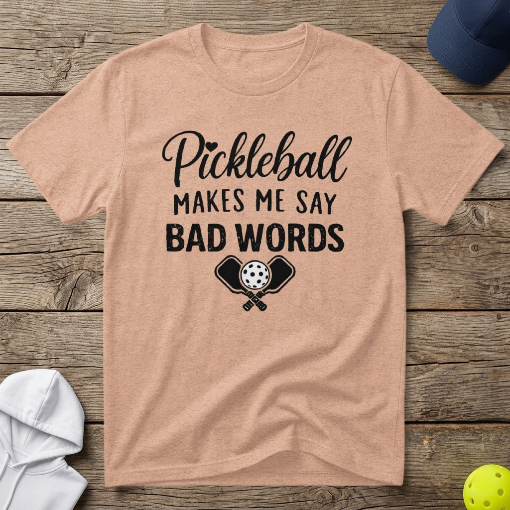 Peach t-shirt with "Pickleball Makes Me Say Bad Words" and crossed paddles.