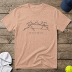 Peach t-shirt with minimalist line drawing of pickleball players and text "The Art of the Game".