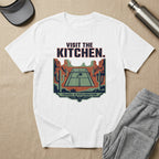 T-shirt with desert scene, tennis court, and "Visit the Kitchen" text.