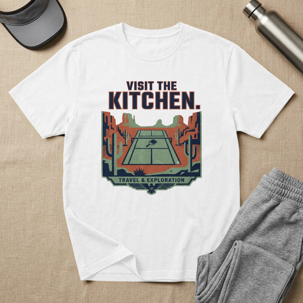 T-shirt with desert scene, tennis court, and "Visit the Kitchen" text.