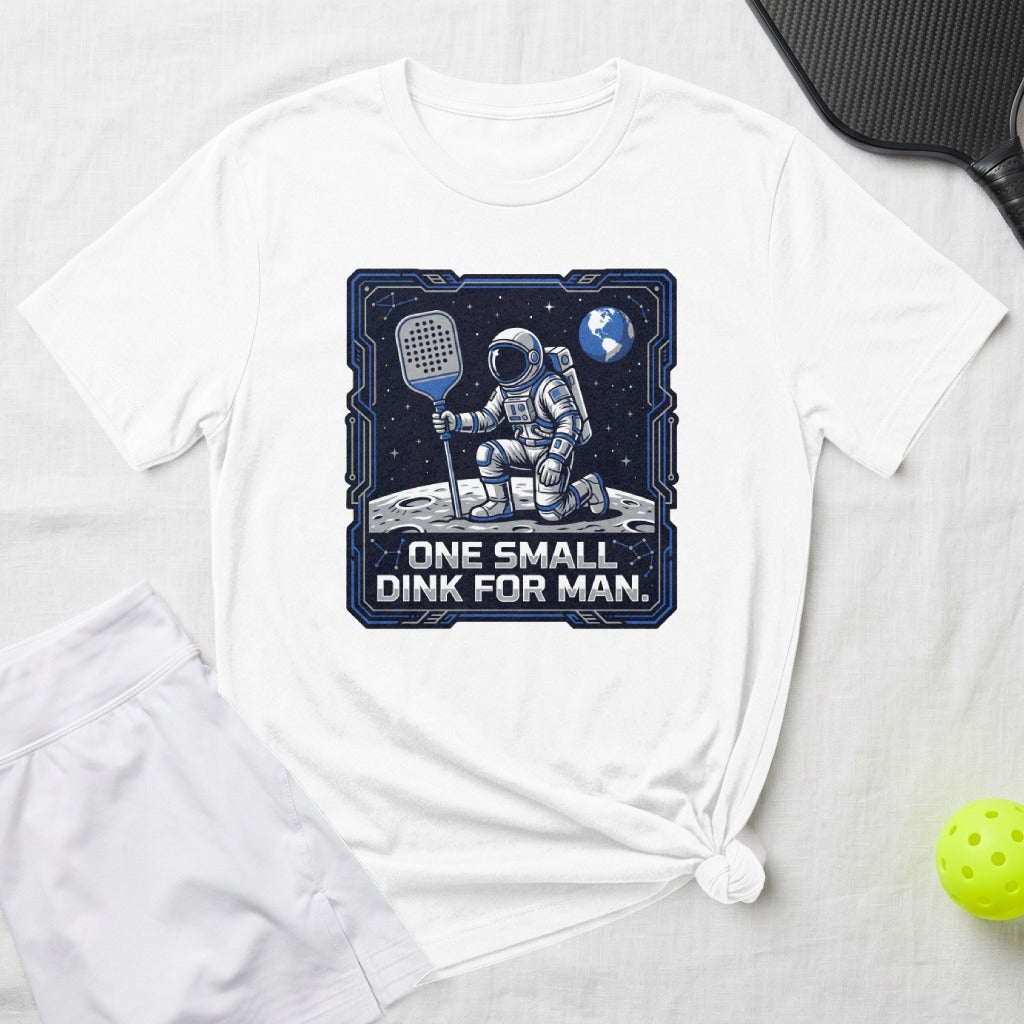 Astronaut kneeling on moon, holding pickleball paddle, Earth in background.