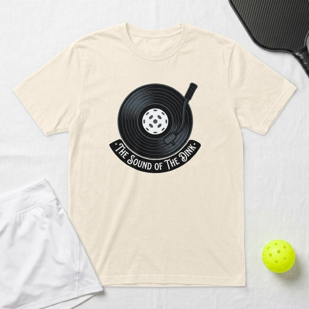 Cream t-shirt with a graphic of a vinyl record labeled "The Sound of the Dink."