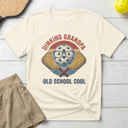 Pickleball t-shirt with "Dinking Grandpa Old School Cool" text and crossed paddles graphic.