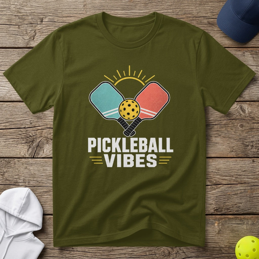 Olive green t-shirt with "Pickleball Vibes" text and graphic of paddles and ball.