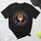 Black t-shirt with distressed "Established on the Court" pickleball paddle graphic.