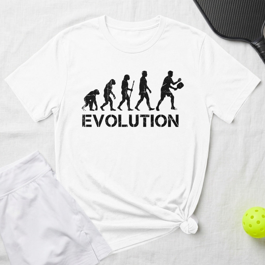 T-shirt with "EVOLUTION" text and pickleball player silhouette graphic.