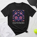 Black t-shirt with a colorful floral and bird design featuring pickleball paddles.