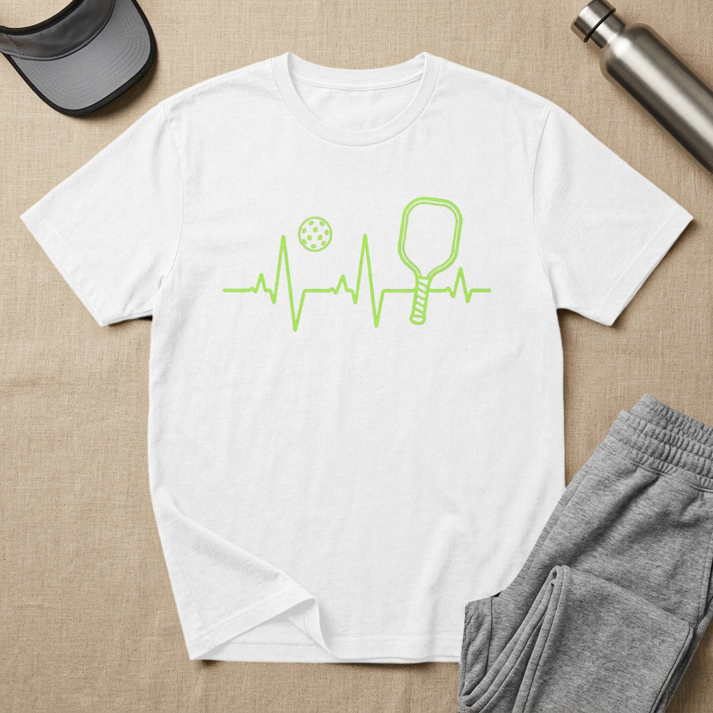 White t-shirt with green pickleball heartbeat graphic and paddle.
