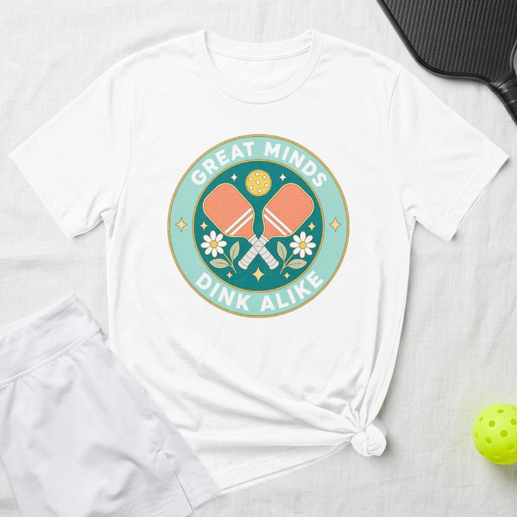 White t-shirt with "Great Minds Dink Alike" pickleball graphic.