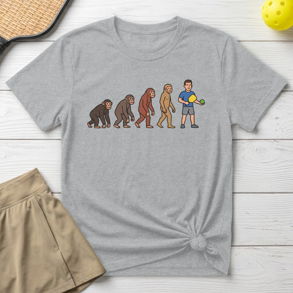 T-shirt showing the evolution of man to a pickleball player.