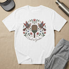 White t-shirt with embroidered birds, paddle, and "Court & Garden" text.