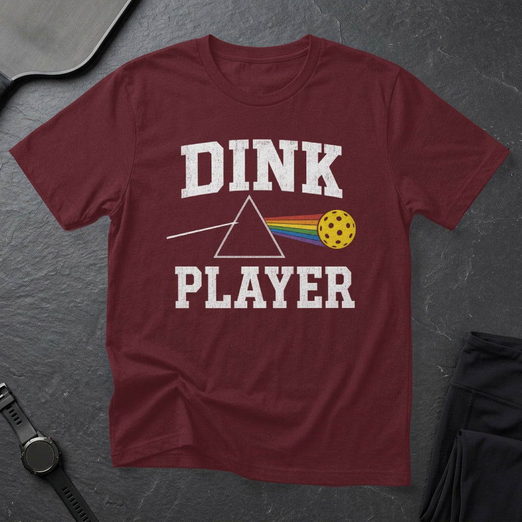 Maroon t-shirt with "DINK PLAYER" and a prism with a pickleball in place of a rainbow.