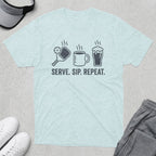 Light blue t-shirt with pickleball, coffee, and repeat icons, and text "SERVE. SIP. REPEAT."