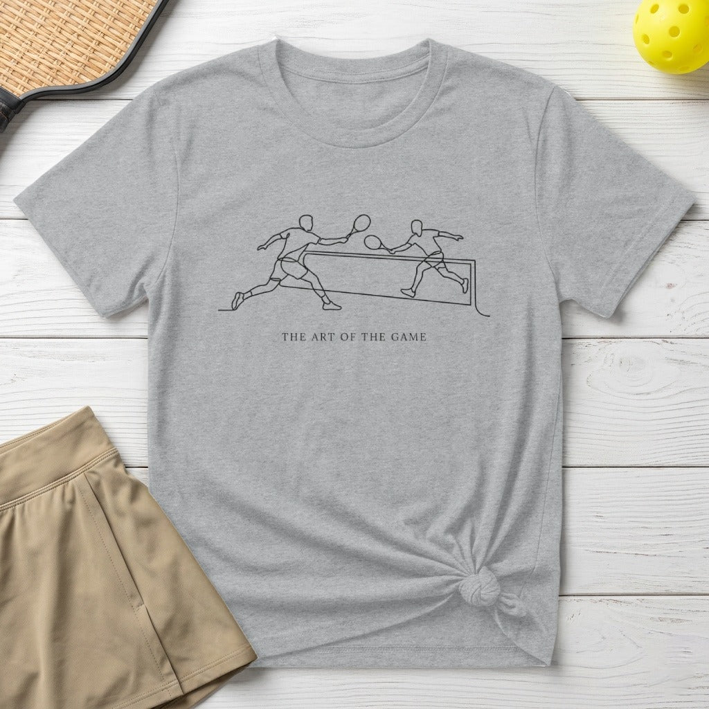 Grey t-shirt with black line art of pickleball players and text "THE ART OF THE GAME".