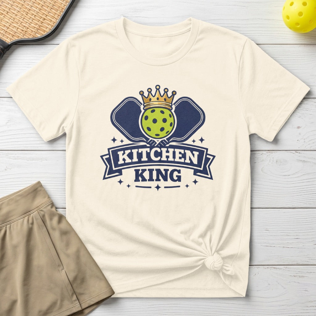 Cream t-shirt with "Kitchen King" logo featuring pickleball paddles and crown.