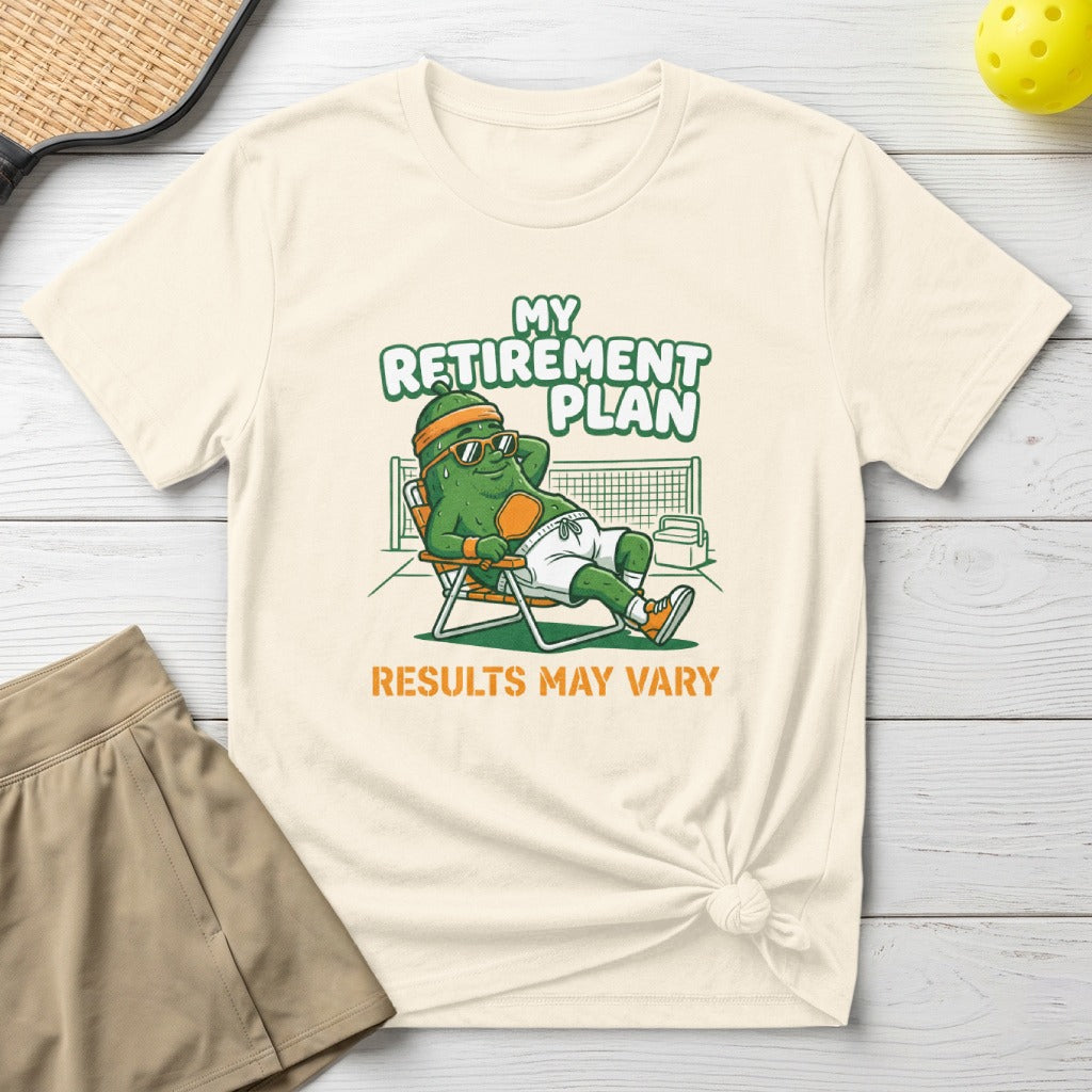 T-shirt with cartoon pickle relaxing on lounge chair, text "My Retirement Plan Results May Vary".