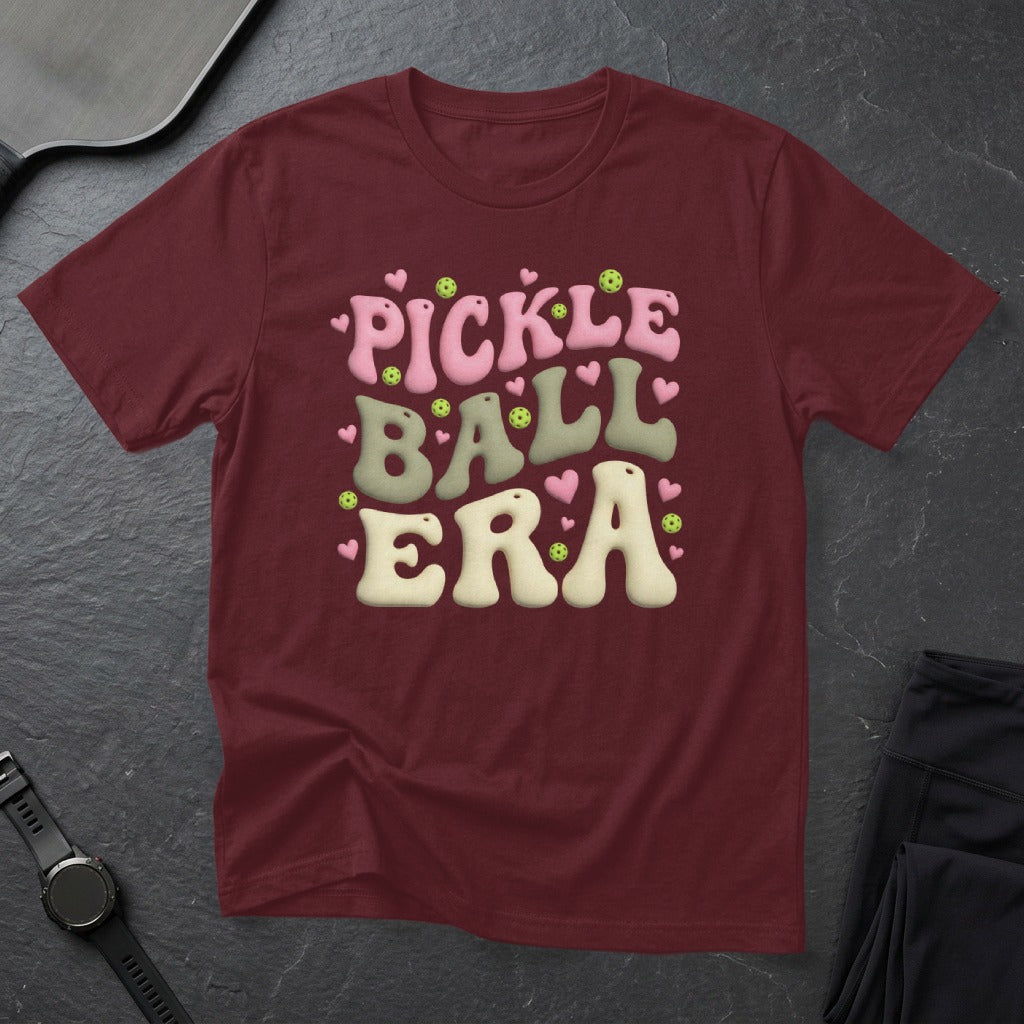 Maroon t-shirt with "Pickleball Era" in bubbly pink and green text.