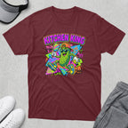 Maroon t-shirt featuring a cartoon pickle playing pickleball, text reads "Kitchen King".