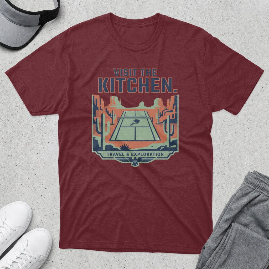 Maroon t-shirt with a desert pickleball court graphic and "Visit the Kitchen" text.