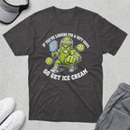T-shirt with pickleball player pickle holding paddle, "If you're looking for a soft serve, go get ice cream."