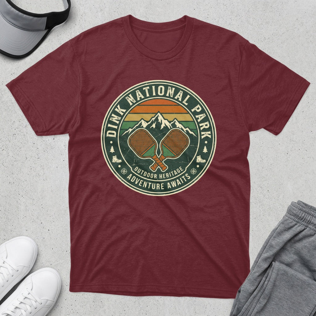 Maroon t-shirt with "Dink National Park Outdoor Heritage Adventure Awaits" logo.