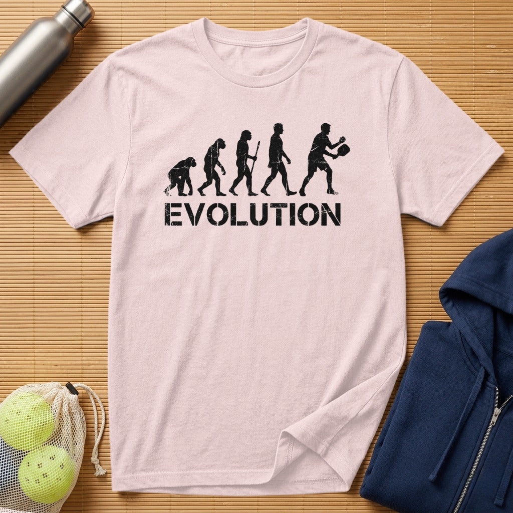 Pale pink t-shirt with "EVOLUTION" text and silhouette figures playing pickleball.